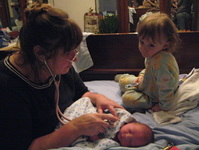 Susie Terwilliger checking newborn